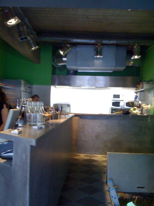 My kitchen - bar on the left, kitchen at the back. Yes, it really is as small as it looks